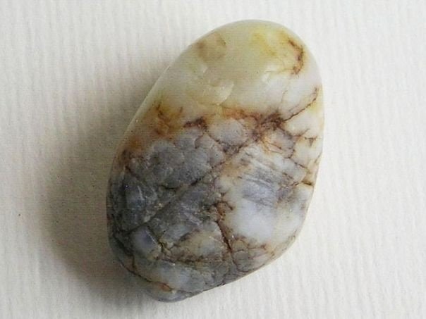 Greyish white river pebble with rough side – (9871)